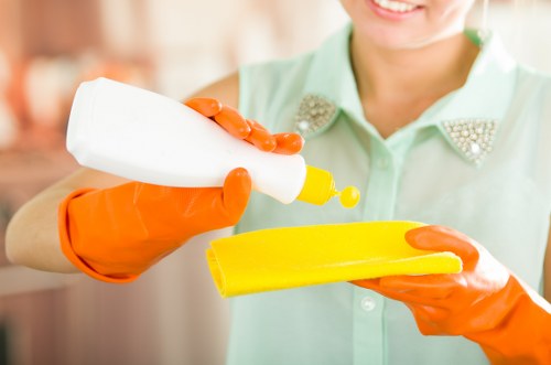 Cleaning team removing dust after construction in a renovated room